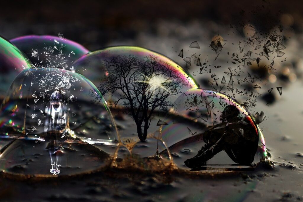 a group of bubbles with a tree and a person in the middle