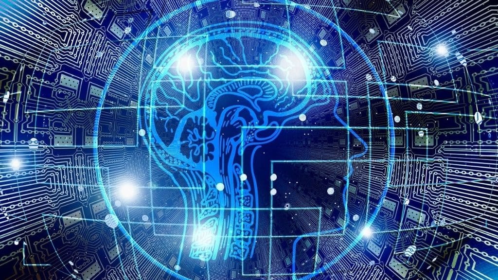 Illustrazione di un cervello stilizzato all’interno di un circuito elettronico, simbolo dell’Intelligenza Artificiale e della sua connessione con la tecnologia digitale
