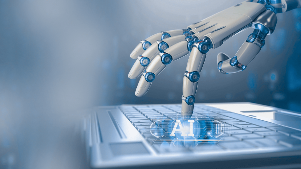Mano robotica che preme una tastiera con scritta AI, simbolo di automazioni e rischio di azioni guidate dall’intelligenza artificiale